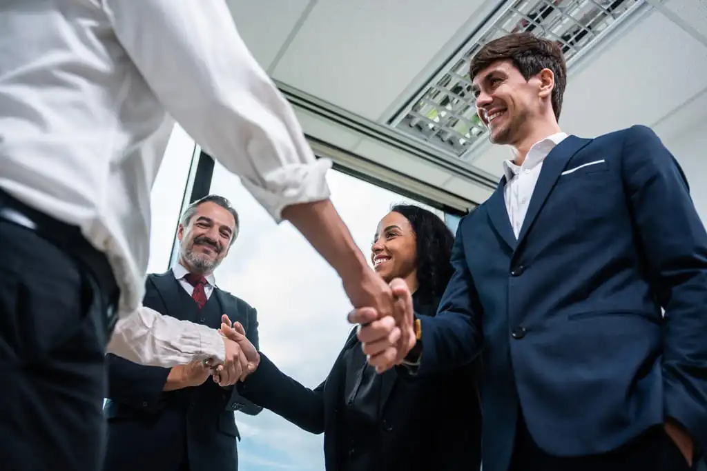 two parties with people shaking hands