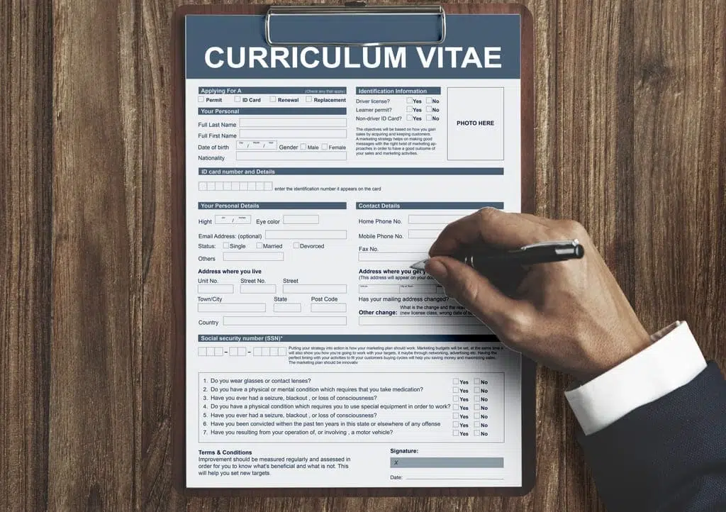 image of a CV and a hand writing in it