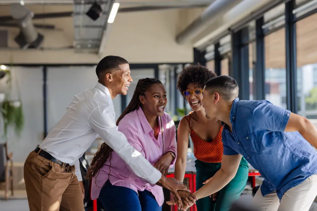 Team of 4 workers celebrating